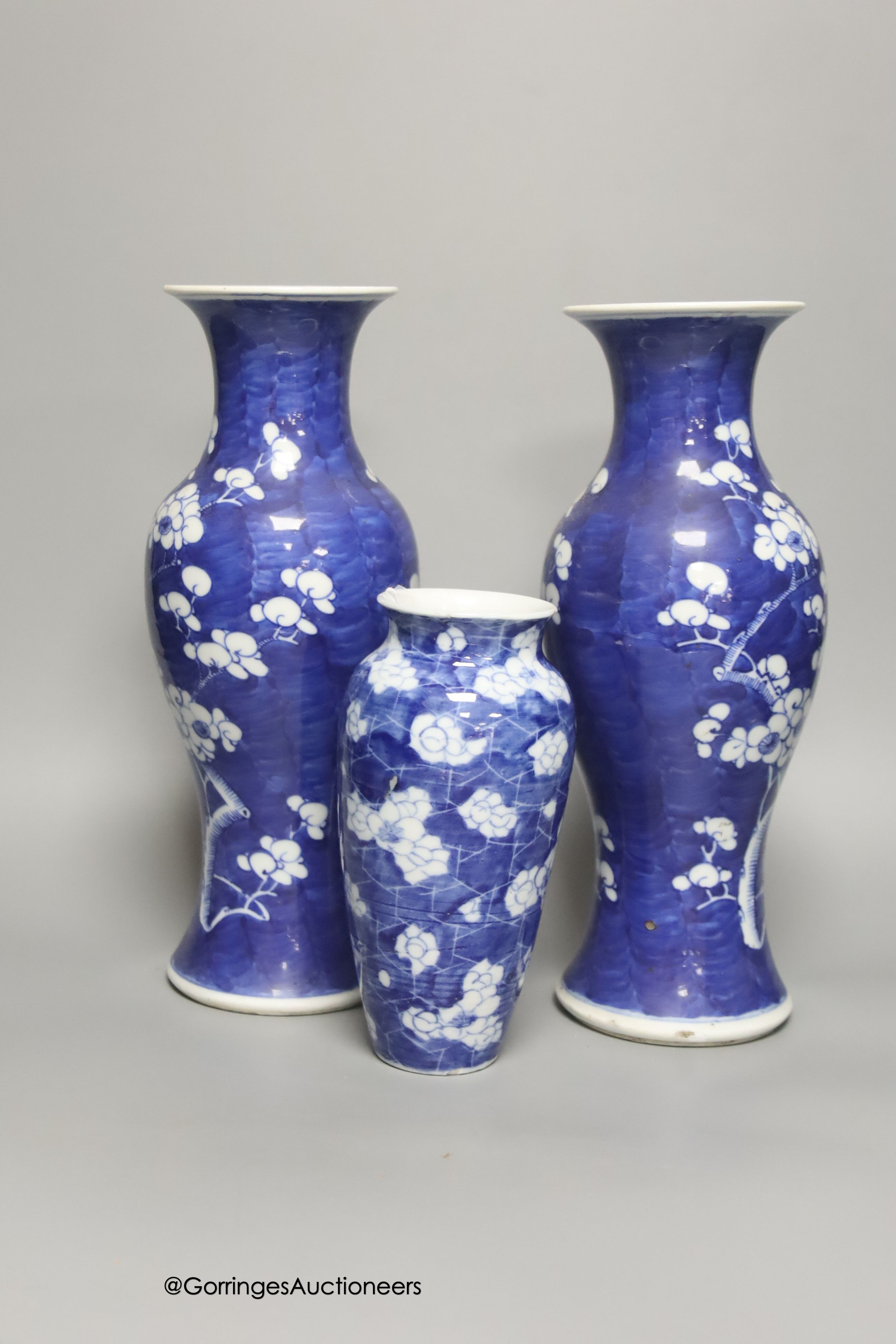 A pair of late 19th century Chinese prunus blossom baluster vases, 30cm, and a Japanese ovoid vase